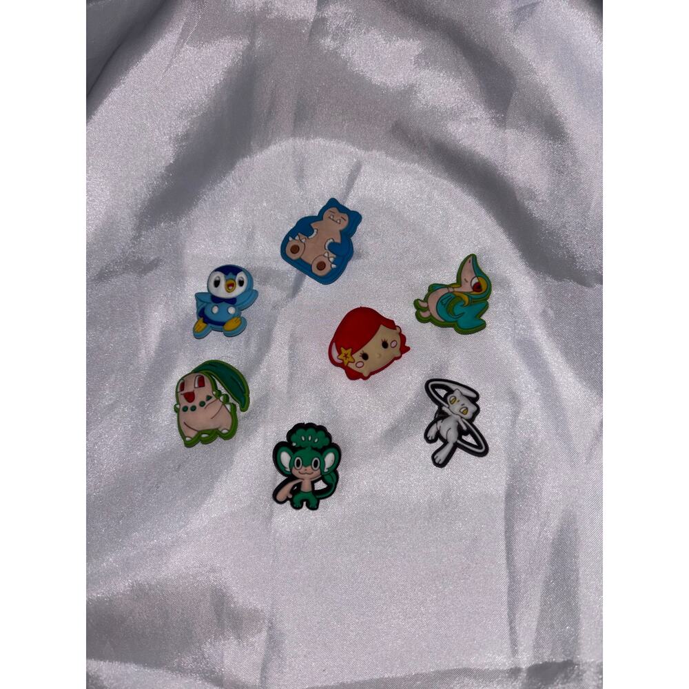 6 POKÉMON and 1 Princess Ariel Charm
All used but in Good Condition.